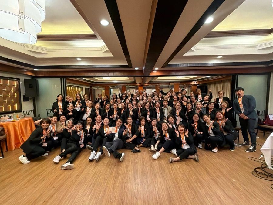 A full training-camp cohort with their facilitators