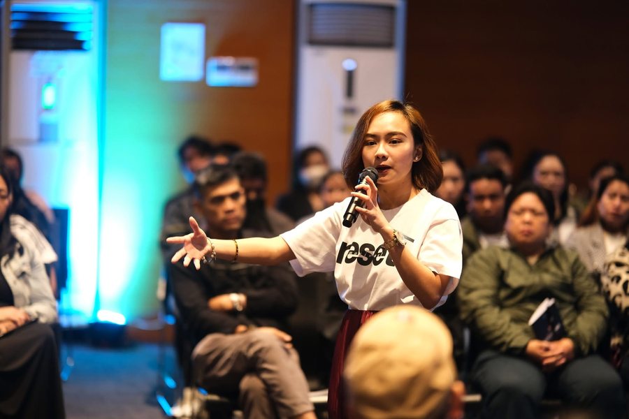 A SoulSync facilitator teaching a full room during a session