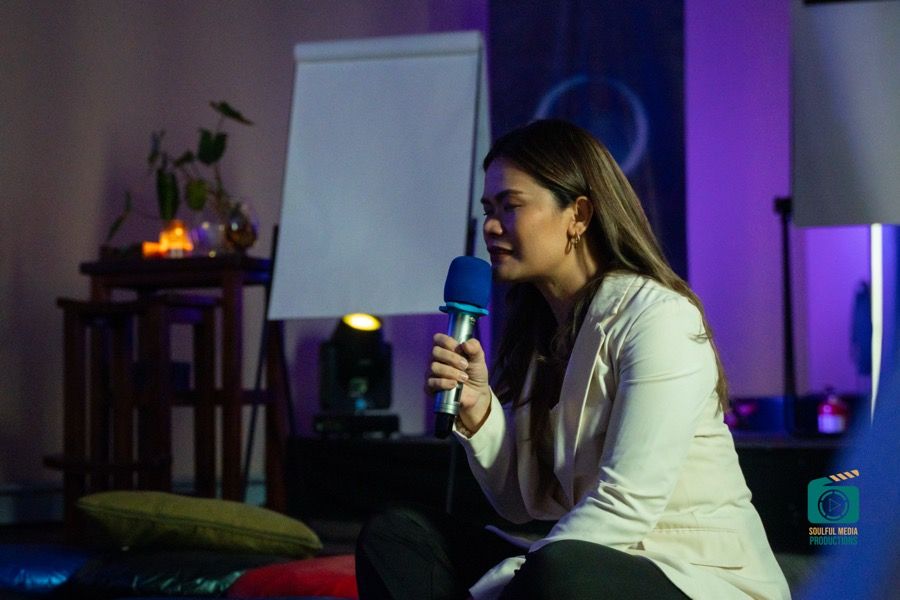 A SoulSync coach delivering a keynote