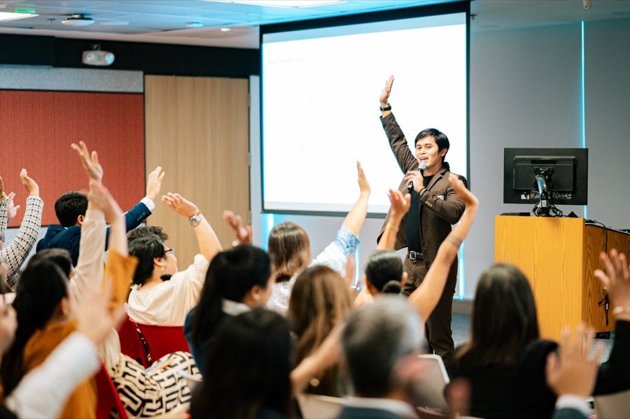 Hands raised during a SoulSync leadership session