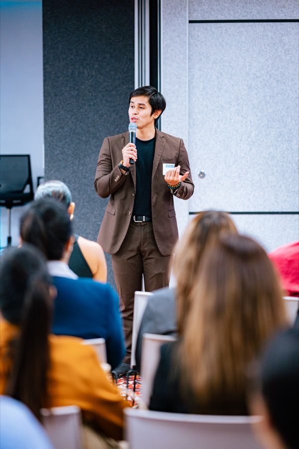 A speaker taking questions from the audience