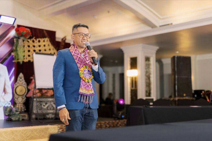 A SoulSync coach speaking at a conference
