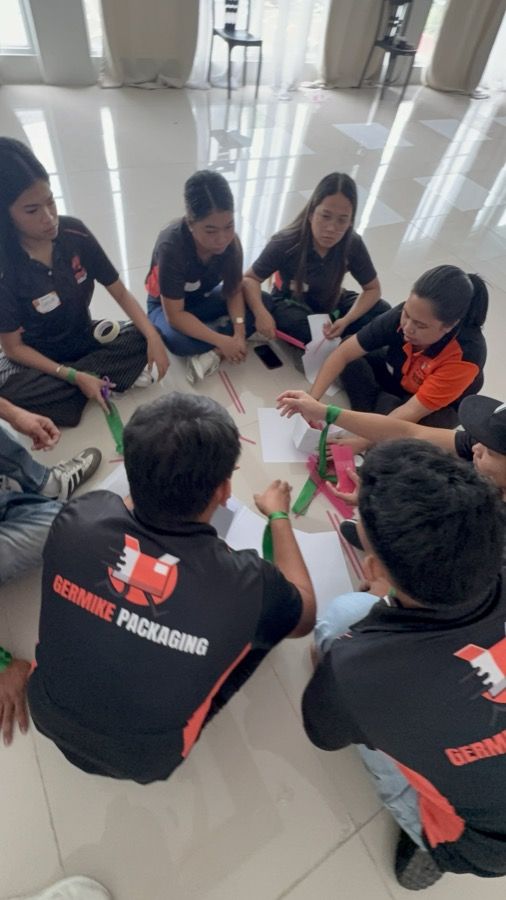 A team working through an exercise together
